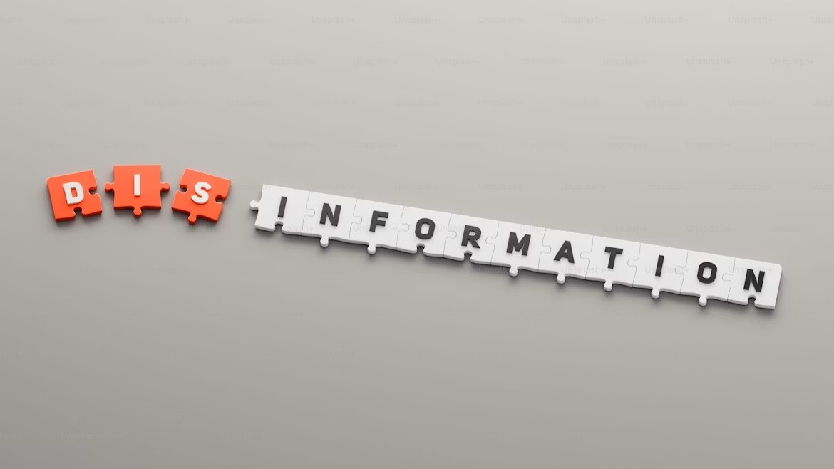 A chain with letters spelling out dis - information.